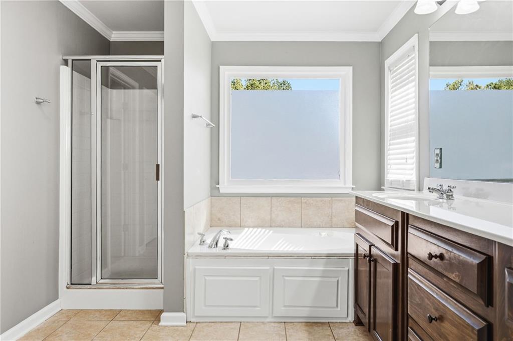 313 Spring Hill Drive Canton, GA 30115 - Photo 20 of 35 a bathroom with a sink and a bathtub