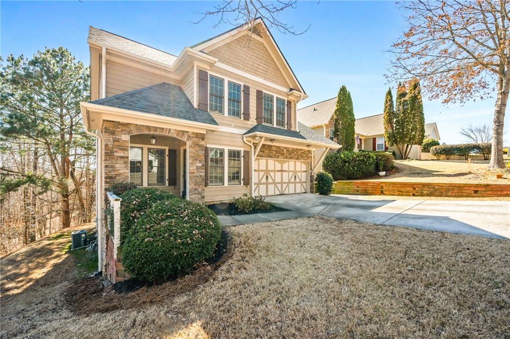 313 Spring Hill Drive Canton, GA 30115 - Photo 2 of 35 a view of a house with a swimming pool