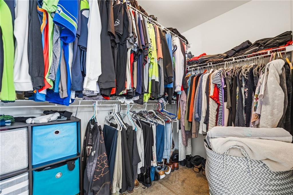 313 Spring Hill Drive Canton, GA 30115 - Photo 22 of 35 a view of walk in closet with clothes