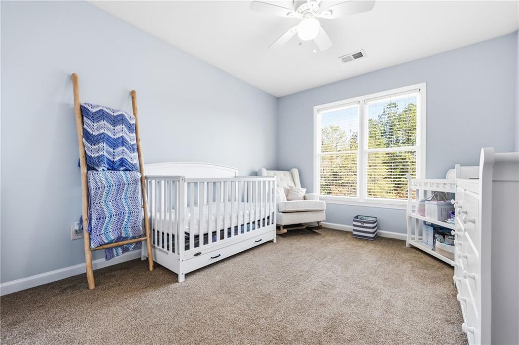 313 Spring Hill Drive Canton, GA 30115 - Photo 23 of 35 a bedroom with furniture and a window