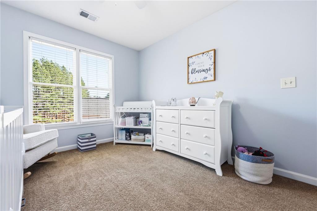 313 Spring Hill Drive Canton, GA 30115 - Photo 24 of 35 a view of a bedroom with baby toys
