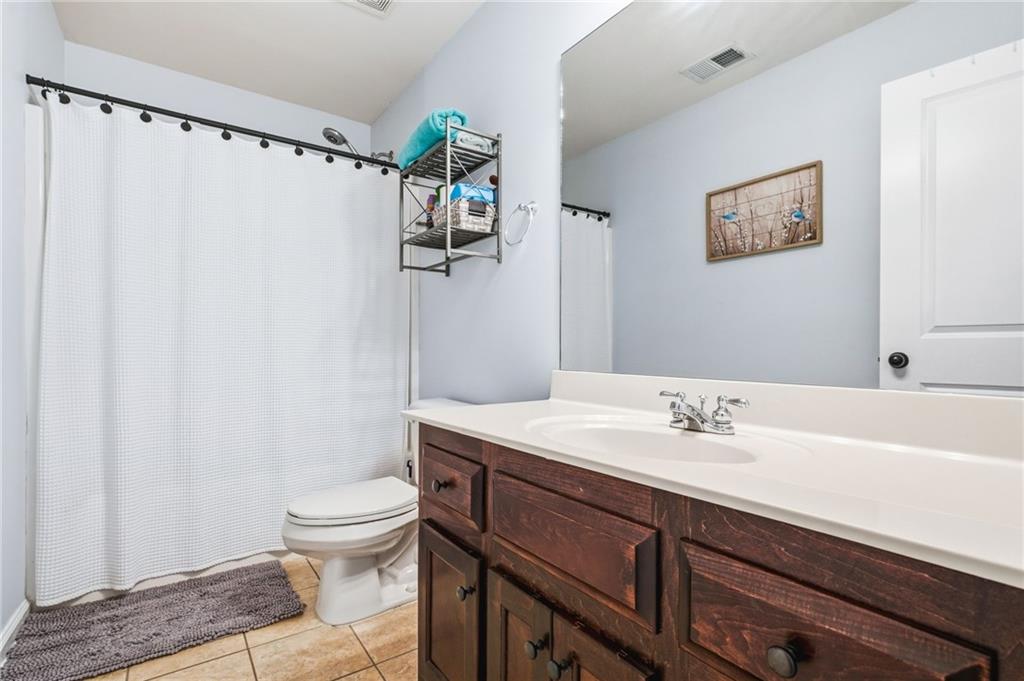 313 Spring Hill Drive Canton, GA 30115 - Photo 25 of 35 a bathroom with a sink a toilet and shower