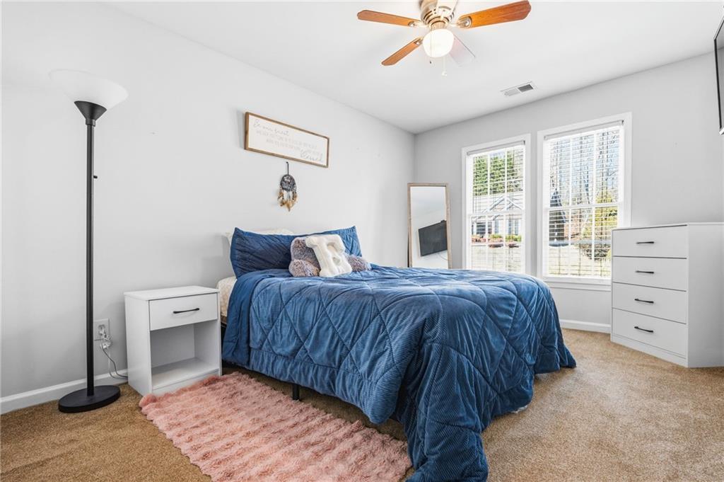 313 Spring Hill Drive Canton, GA 30115 - Photo 26 of 35 a bedroom with a large bed and a window
