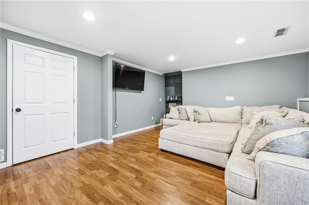 313 Spring Hill Drive Canton, GA 30115 - Photo 30 of 35 a large bedroom with a bed and a flat screen tv