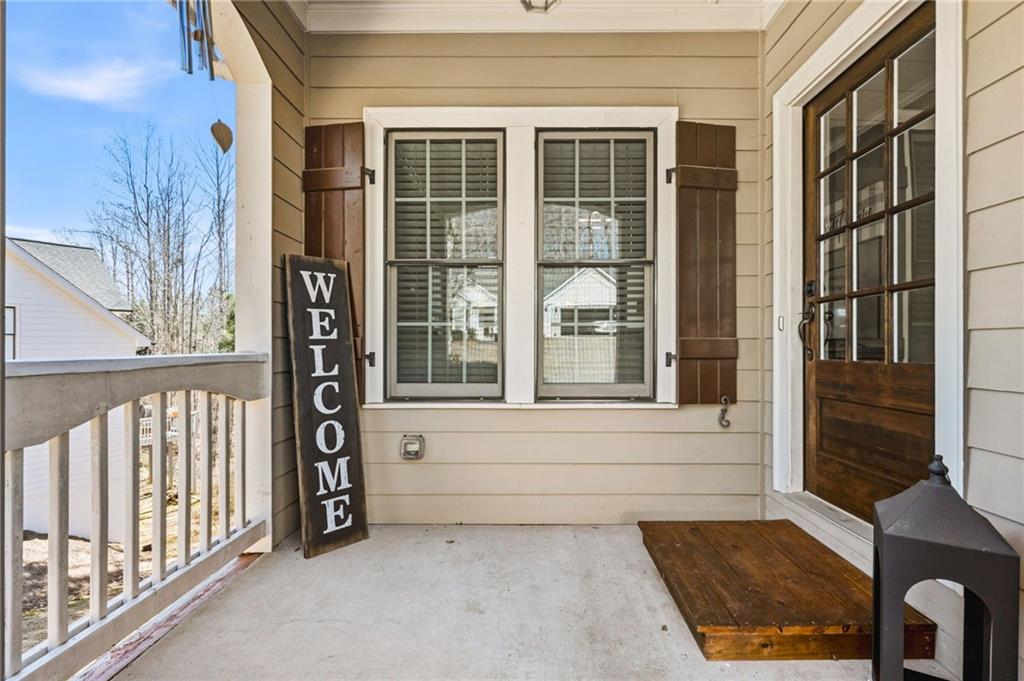 313 Spring Hill Drive Canton, GA 30115 - Photo 4 of 35 a view of front door and porch with furniture