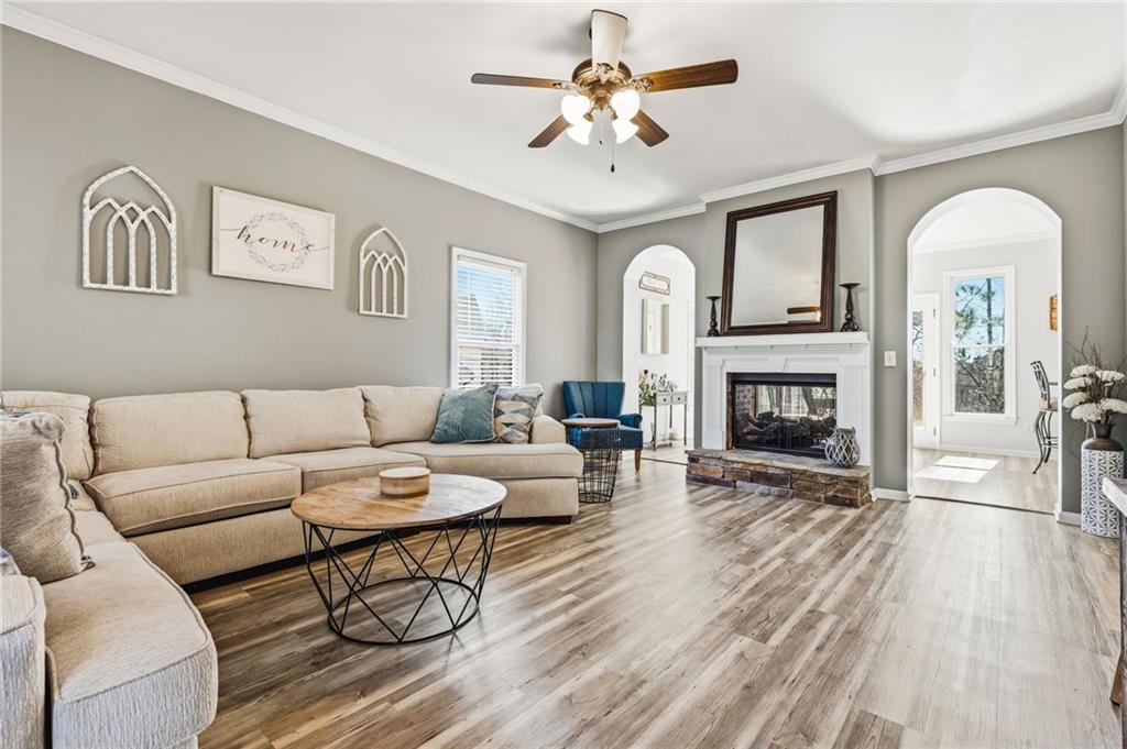 313 Spring Hill Drive Canton, GA 30115 - Photo 6 of 35 a living room with furniture and a fireplace