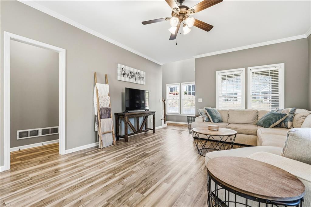 313 Spring Hill Drive Canton, GA 30115 - Photo 8 of 35 a living room with furniture and a flat screen tv