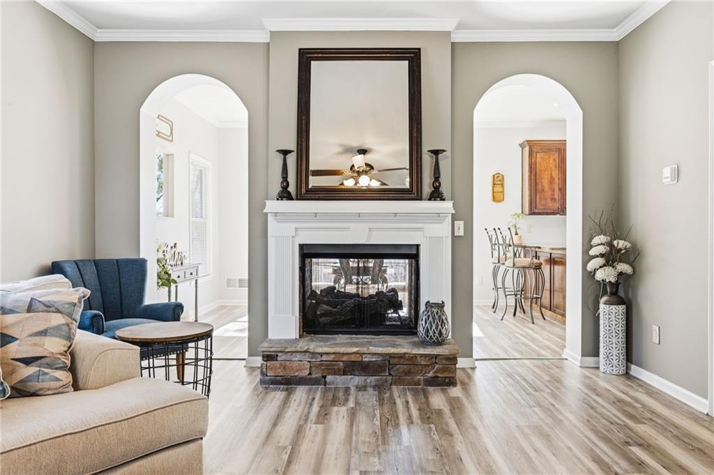 313 Spring Hill Drive Canton, GA 30115 - Photo 9 of 35 a living room with furniture and a fireplace
