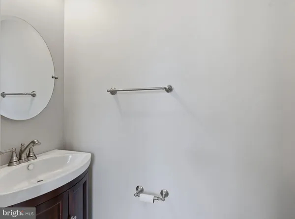 a kitchen with stainless steel appliances granite countertop a refrigerator a stove a microwave and a chandelier