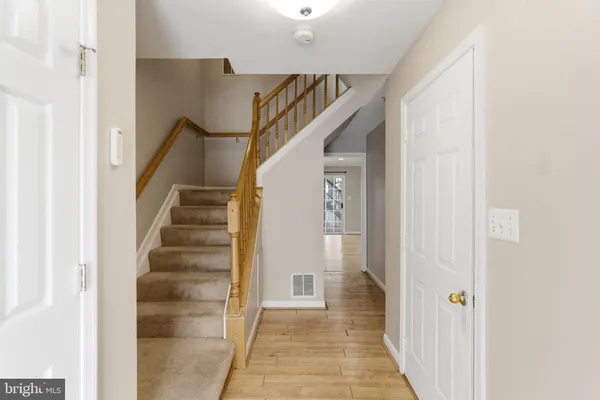 a view of a hallway with a door