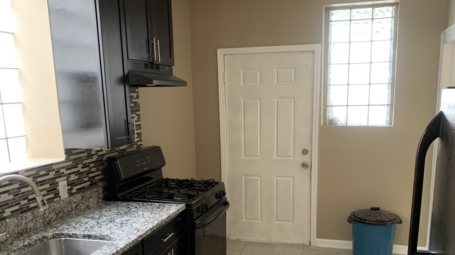 7831 South Cornell Avenue, Unit 3 Chicago, IL 60649 - Photo 10 of 11 a kitchen with a sink and a stove