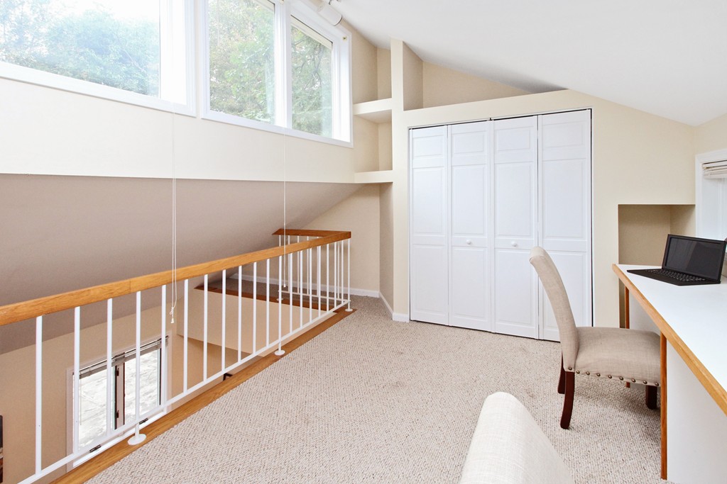83 Spring Valley Road Belmont, MA 02478 - Photo 16 of 30 a view of a hallway with workspace