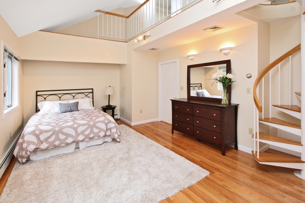 83 Spring Valley Road Belmont, MA 02478 - Photo 20 of 30 a bedroom with a bed and a dresser