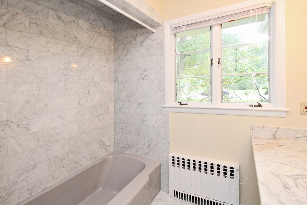 83 Spring Valley Road Belmont, MA 02478 - Photo 24 of 30 a bathroom with a bathtub and a shower