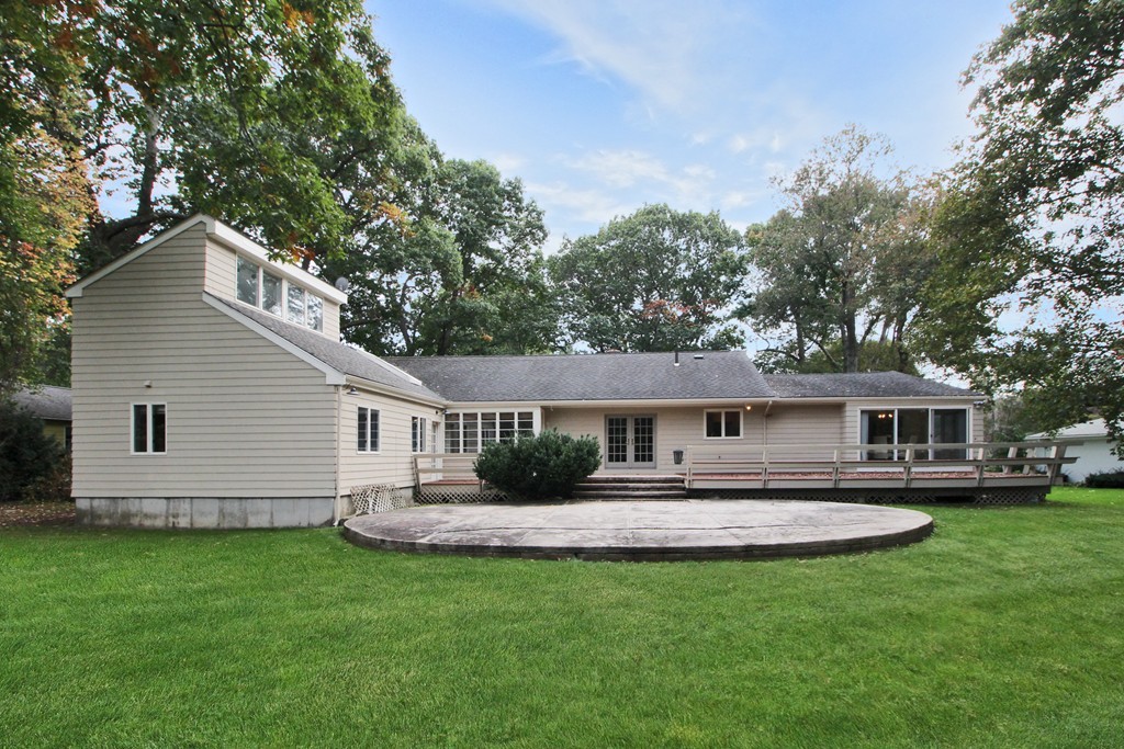 83 Spring Valley Road Belmont, MA 02478 - Photo 29 of 30 a front view of house with yard and green space