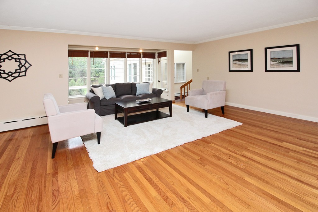 83 Spring Valley Road Belmont, MA 02478 - Photo 3 of 30 a living room with furniture and large windows