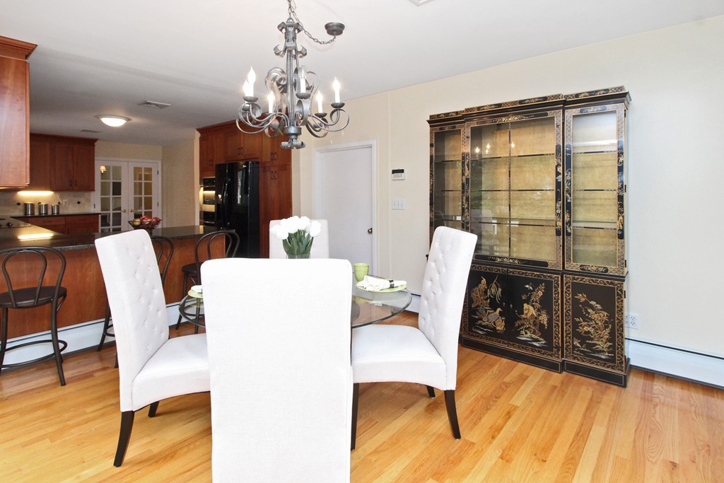 83 Spring Valley Road Belmont, MA 02478 - Photo 8 of 30 a view of a dining room with furniture and wooden floor
