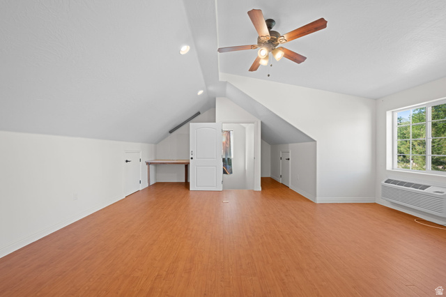 20 Valley Road Leeds, UT 84746 - Photo 43 of 57 Spacious room featuring wood-finish flooring, vaulted ceilings, and a ceiling fan