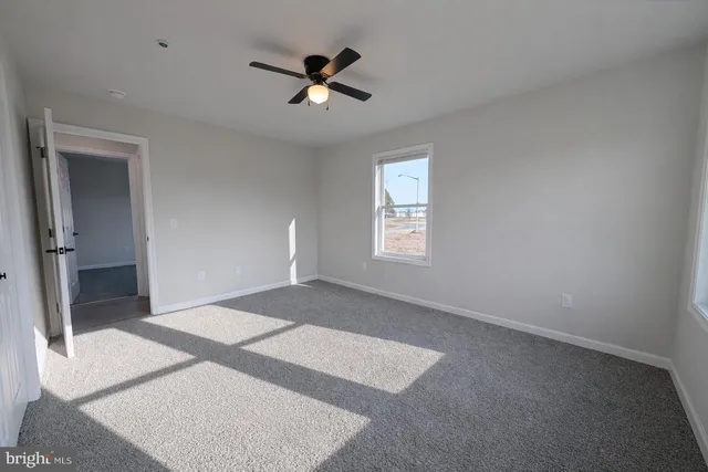 a view of empty room with windows