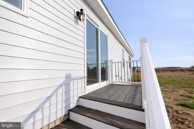 a view of backyard with roof deck
