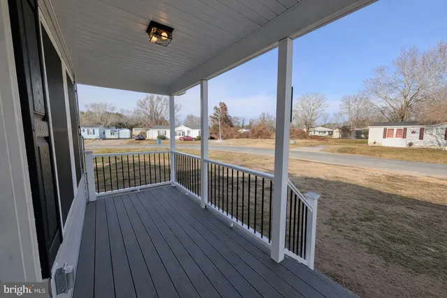 a view of a balcony with wooden floor