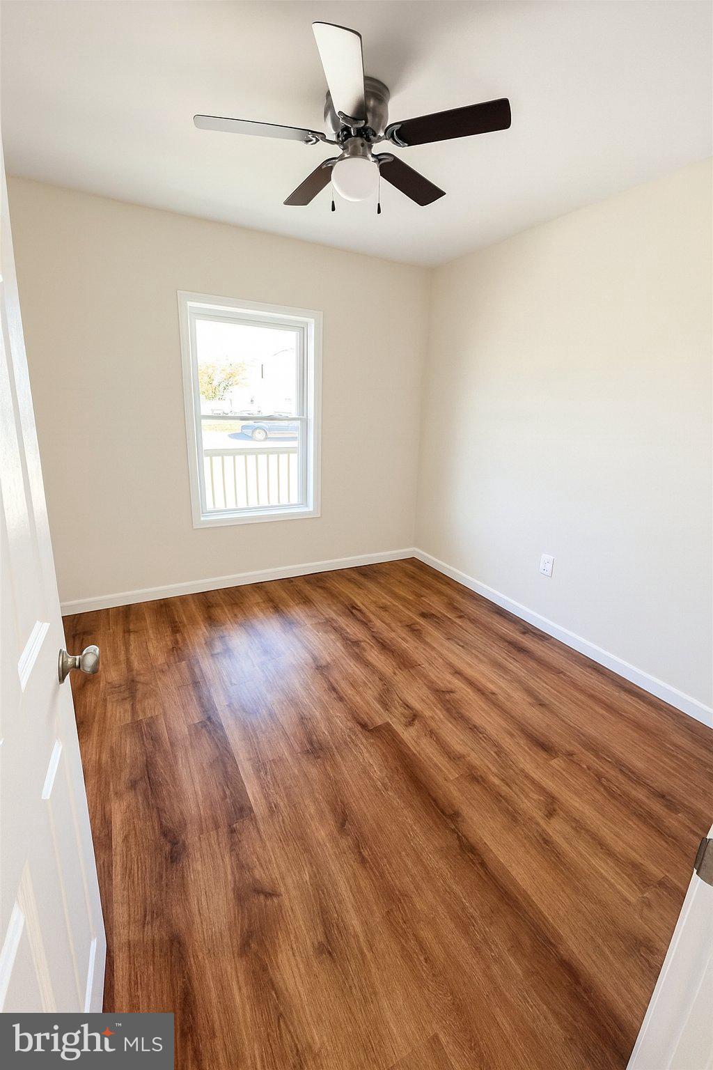 10824 Clipper Circle Princess Anne, MD 21853 - Photo 7 of 9 an empty room with windows and fan