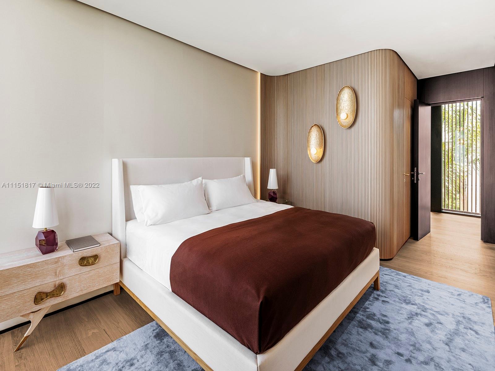 810 Lakeview Drive Miami Beach, FL 33140 - Photo 21 of 35 a bedroom with a bed and window