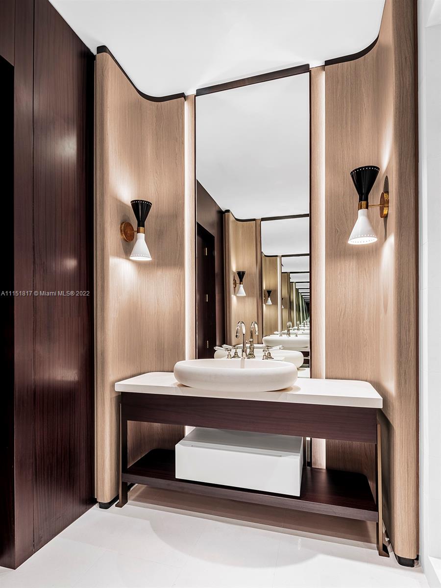 810 Lakeview Drive Miami Beach, FL 33140 - Photo 33 of 35 a bathroom with a sink and a mirror