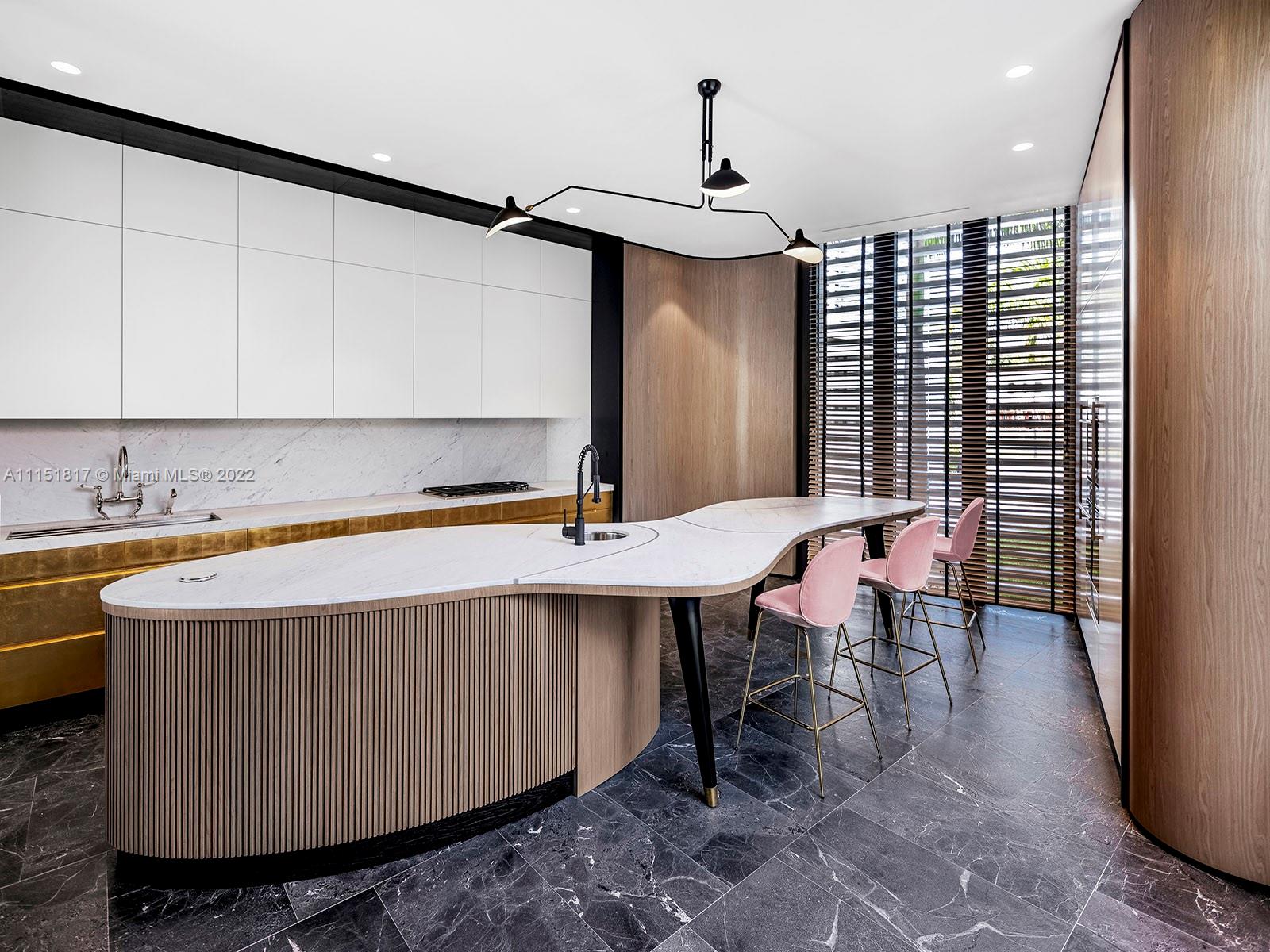 810 Lakeview Drive Miami Beach, FL 33140 - Photo 4 of 35 a kitchen with a sink cabinets and window