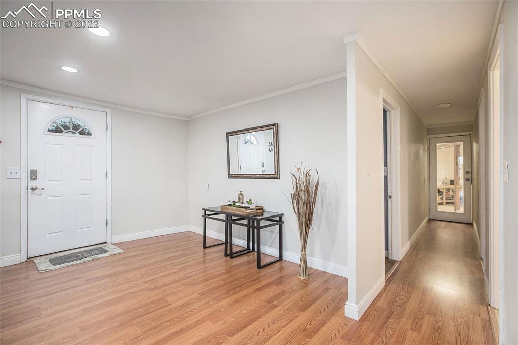 1495 North Yoder Road Yoder, CO 80864 - Photo 12 of 25 a view of a livingroom with wooden floor and furniture
