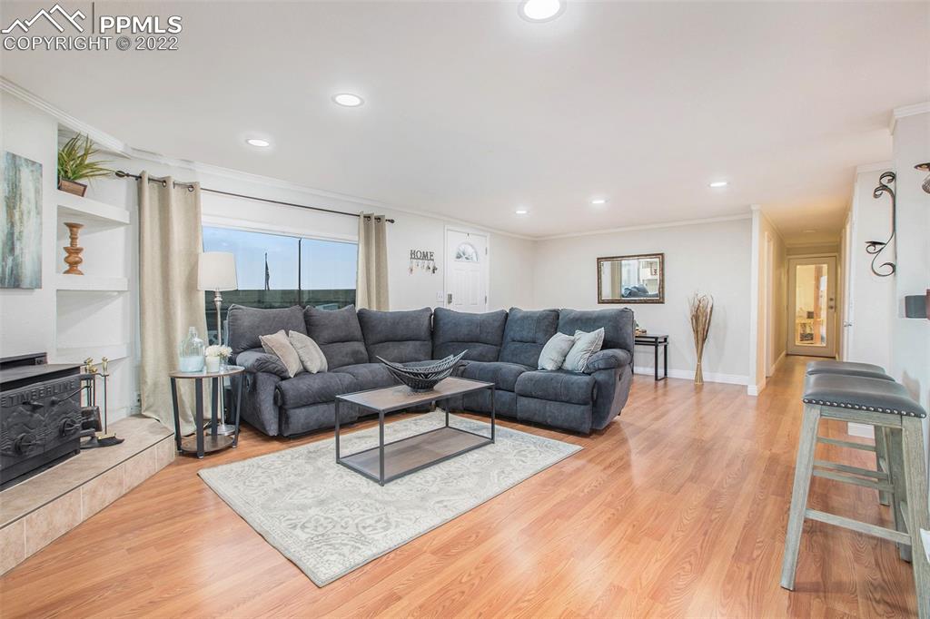 1495 North Yoder Road Yoder, CO 80864 - Photo 14 of 25 a living room with furniture and wooden floor