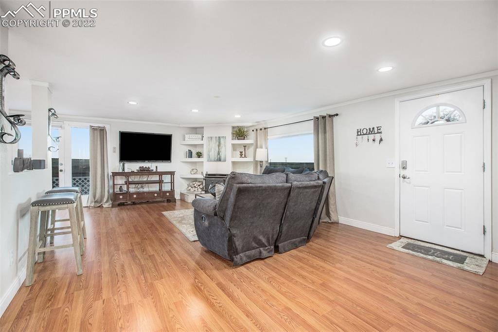 1495 North Yoder Road Yoder, CO 80864 - Photo 19 of 25 a living room with furniture and a wooden floor