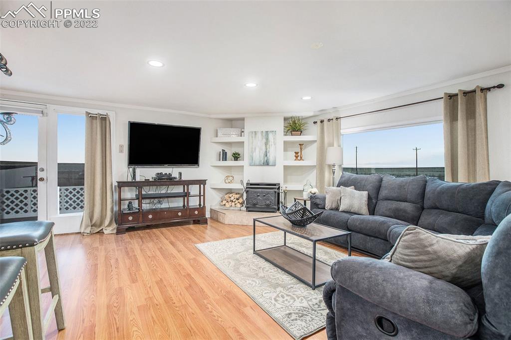 1495 North Yoder Road Yoder, CO 80864 - Photo 2 of 25 a living room with furniture and a flat screen tv