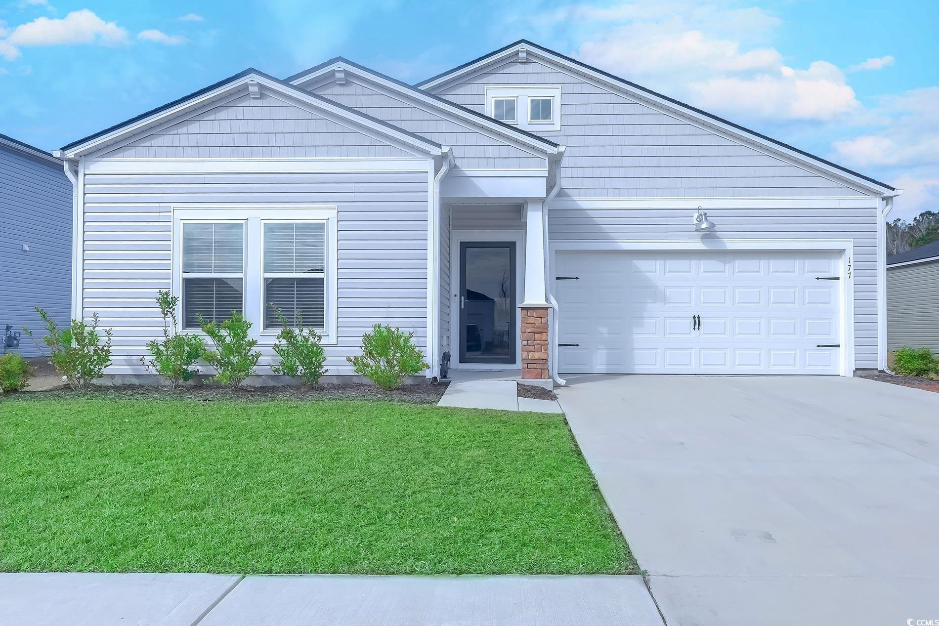 177 Fox Rae Drive Conway, SC 29526 - Photo 1 of 39 View of front of home featuring driveway, a front yard, and an attached garage