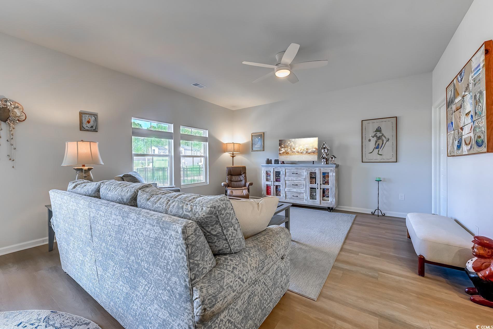 177 Fox Rae Drive Conway, SC 29526 - Photo 11 of 39 Living area with wood finished floors and a ceiling fan