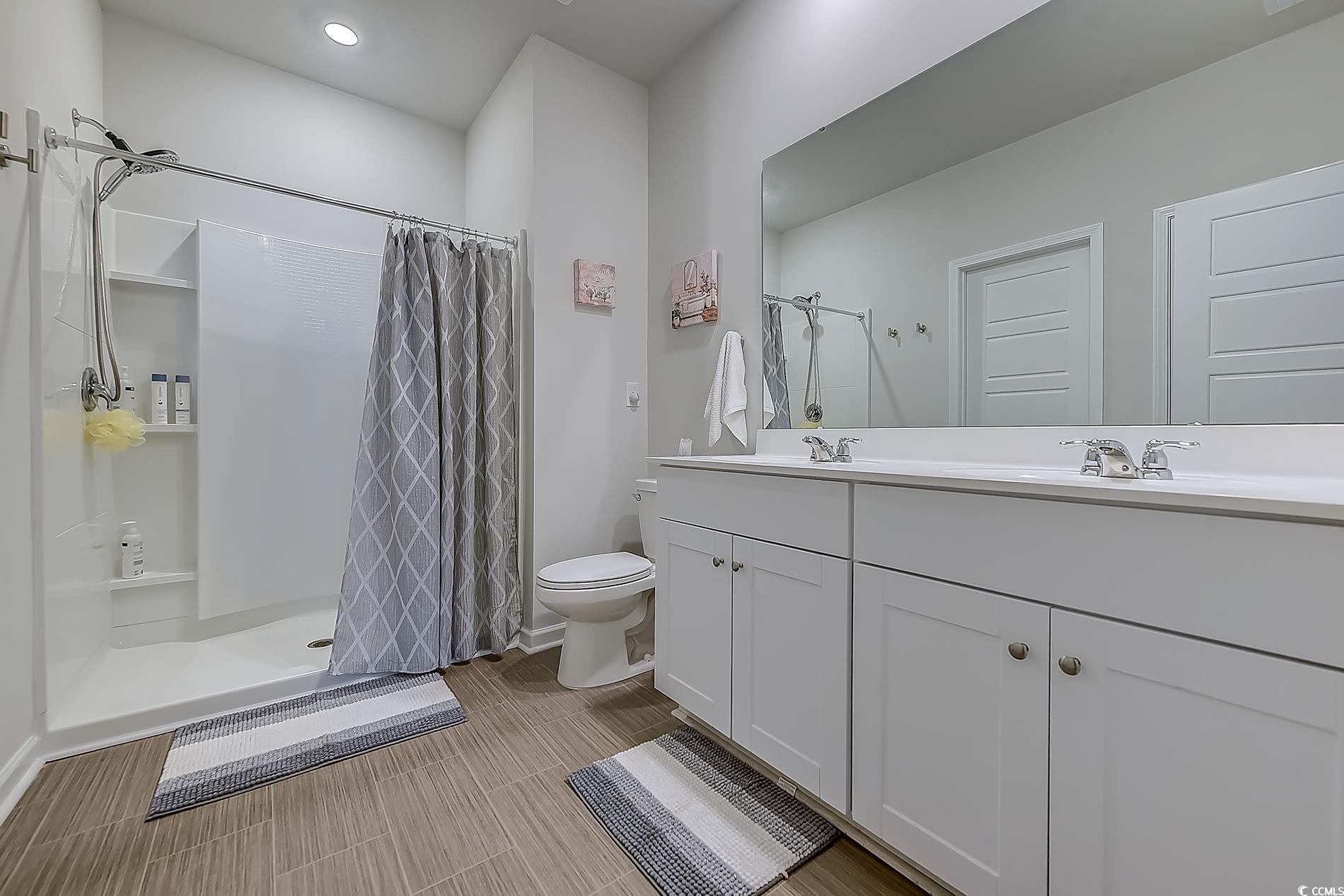 177 Fox Rae Drive Conway, SC 29526 - Photo 17 of 39 Full bathroom featuring double vanity and a stall shower