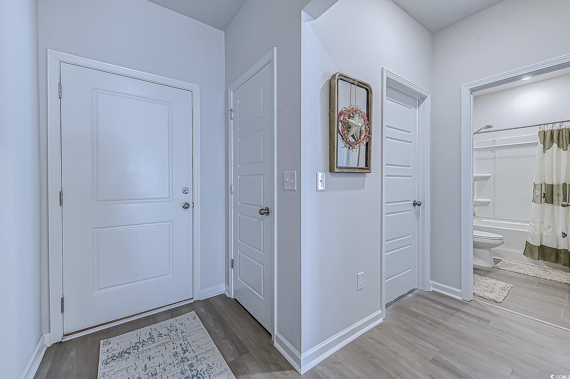 177 Fox Rae Drive Conway, SC 29526 - Photo 4 of 39 Foyer entrance with light wood-style flooring and baseboards