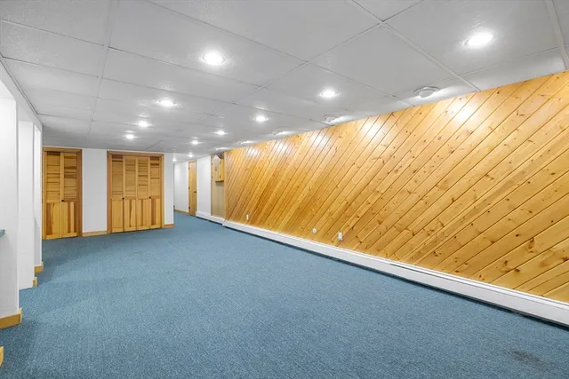 a kitchen with stainless steel appliances granite countertop a refrigerator a stove and a sink