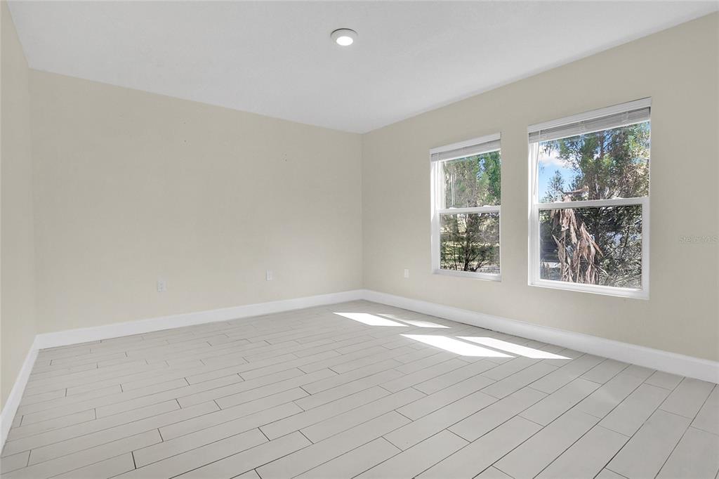 1801 West Highway 329 Citra, FL 32113 - Photo 13 of 34 an empty room with windows