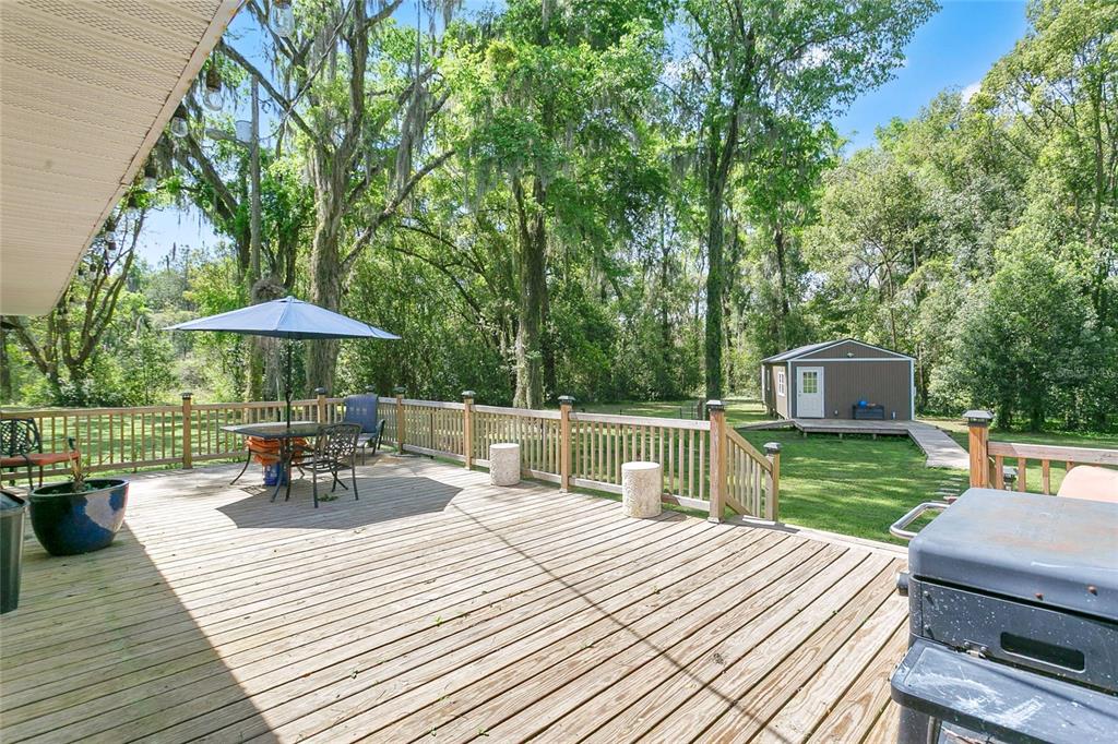 1801 West Highway 329 Citra, FL 32113 - Photo 16 of 34 a front view of a house with a yard