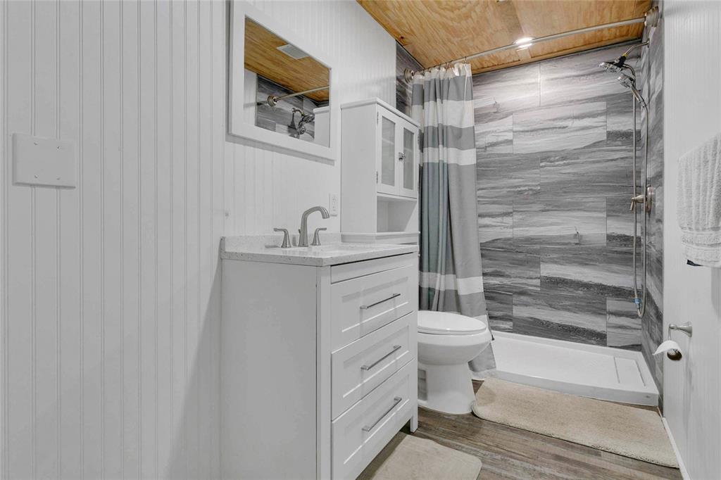 1801 West Highway 329 Citra, FL 32113 - Photo 21 of 34 a bathroom with a sink a toilet and shower