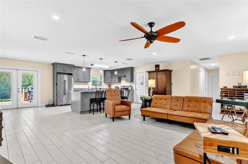 1801 West Highway 329 Citra, FL 32113 - Photo 6 of 34 a living room with furniture kitchen view and a chandelier