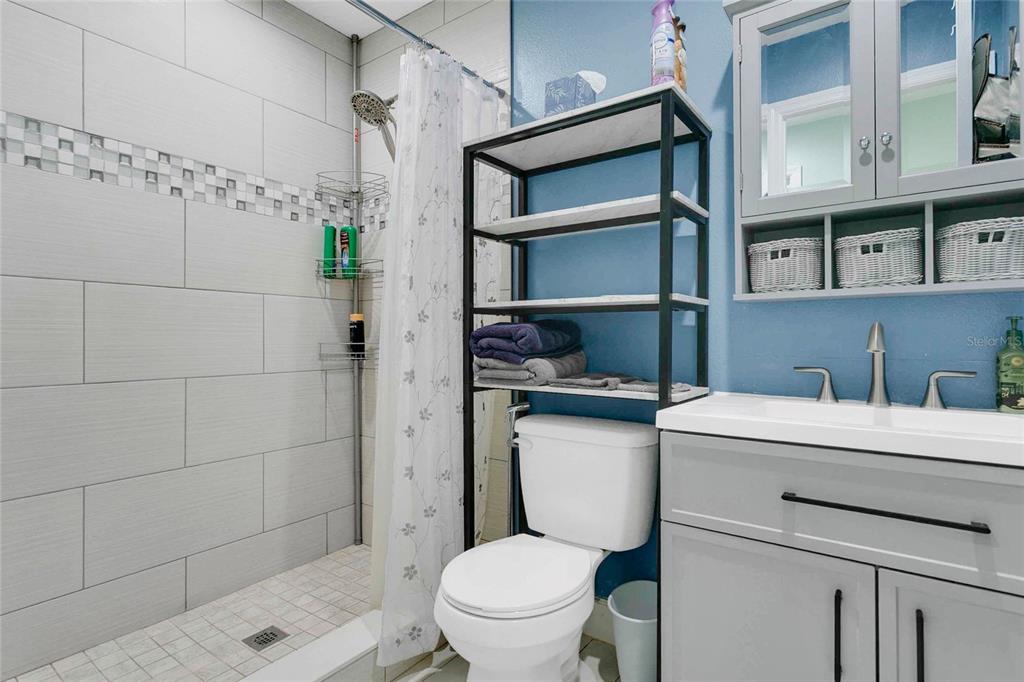 1801 West Highway 329 Citra, FL 32113 - Photo 9 of 34 a bathroom with a sink a toilet and shower