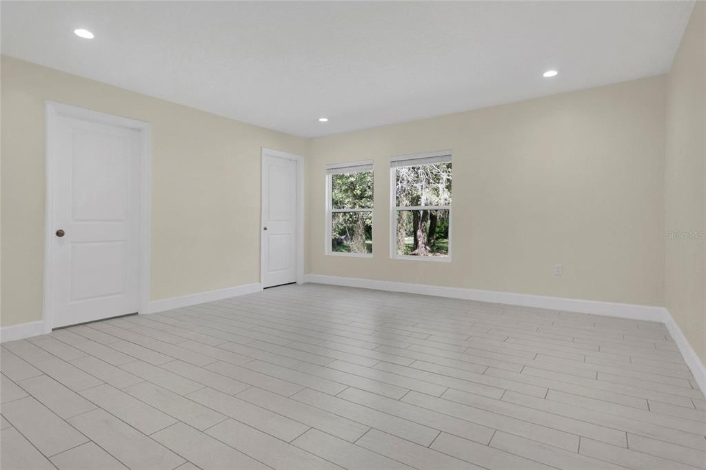 1801 West Highway 329 Citra, FL 32113 - Photo 10 of 34 an empty room with windows