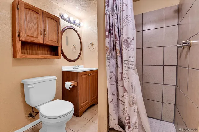 a bathroom with a toilet and a sink