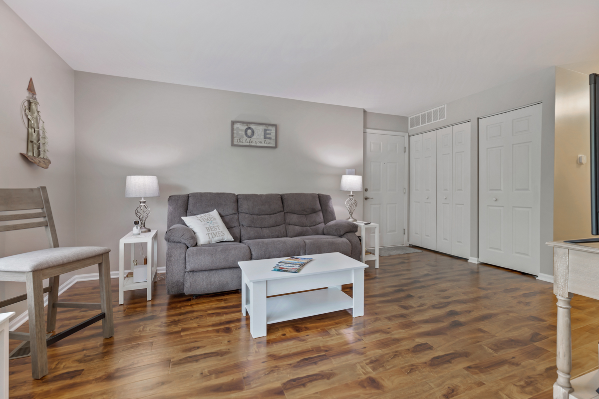 320 Crestview Drive, Unit B Wauconda, IL 60084 - Photo 11 of 28 a living room with furniture and a wooden floor