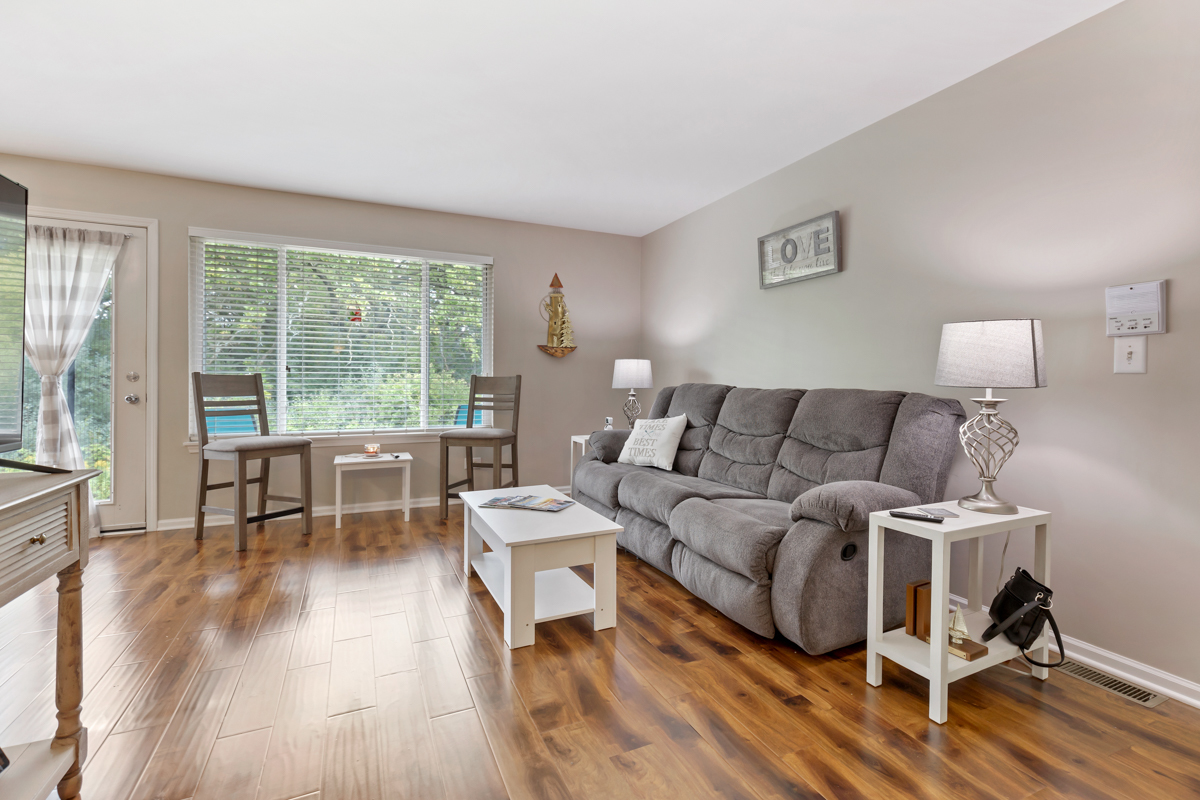 320 Crestview Drive, Unit B Wauconda, IL 60084 - Photo 12 of 28 a living room with furniture and a wooden floor