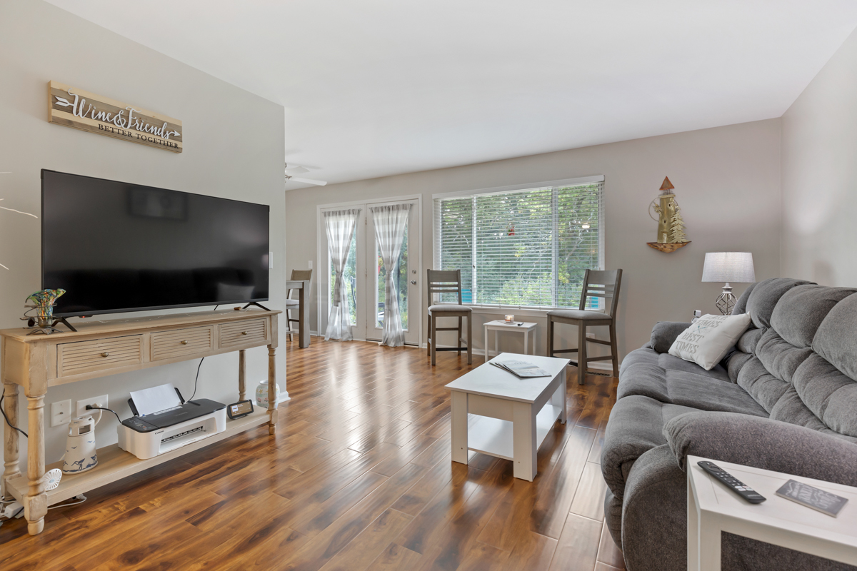 320 Crestview Drive, Unit B Wauconda, IL 60084 - Photo 13 of 28 a living room with furniture and a flat screen tv