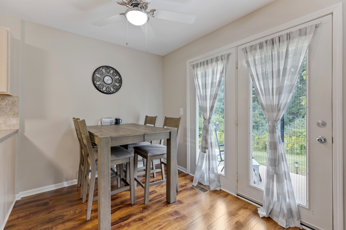 320 Crestview Drive, Unit B Wauconda, IL 60084 - Photo 14 of 28 a view of a dining room with furniture window and wooden floor