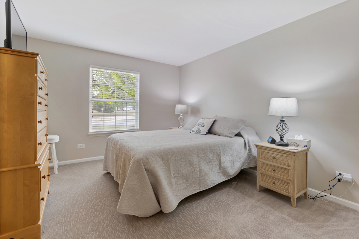 320 Crestview Drive, Unit B Wauconda, IL 60084 - Photo 19 of 28 a bedroom with a bed and a window